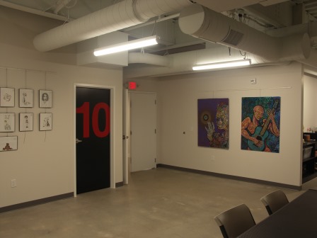 View of the main public space, looking towards the entry to the studios.  All art shown is temporarily hung and can be changed out